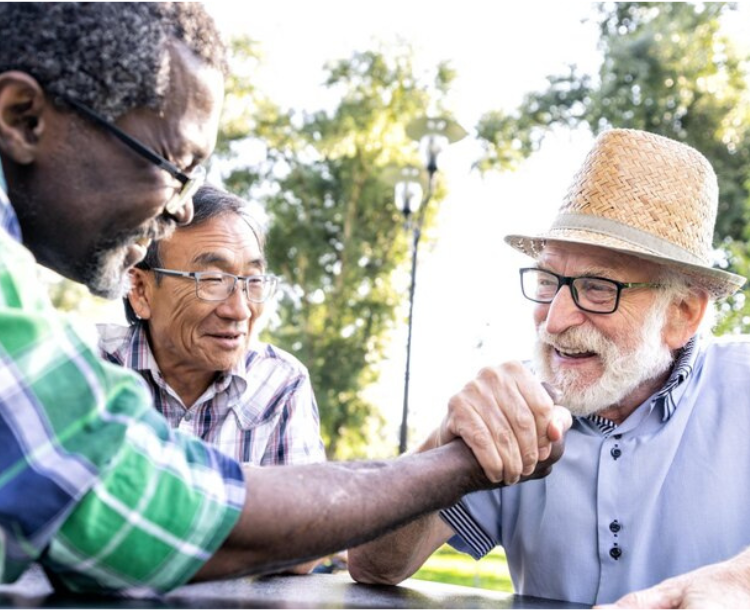 Group of elderly people laughing and enjoying each other's company.