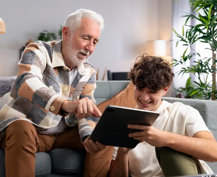 Senior learning to use tablet to bridge digital divide