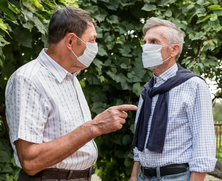 Elderly man receiving assistance during a heatwave – showing the impact of climate change and seniors