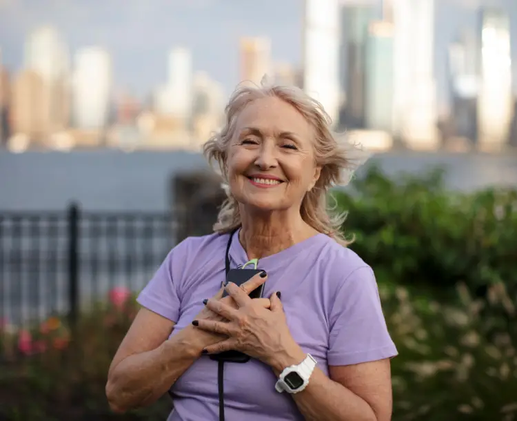 Senior woman smiling outdoors representing purposeful retirement for seniors