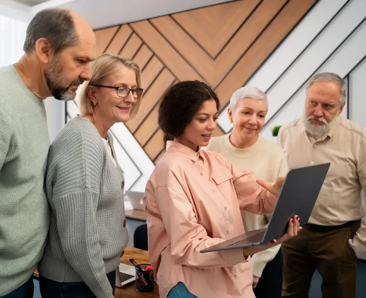 Diverse team showing aging workforce collaborating in office