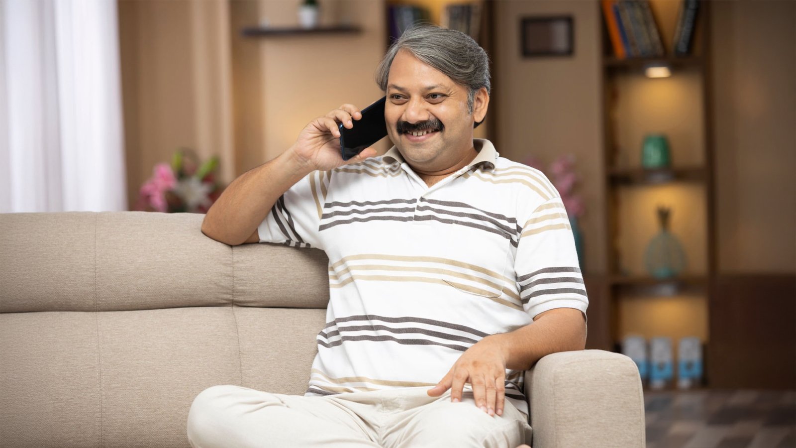 Elderly person confidently using smartphone technology